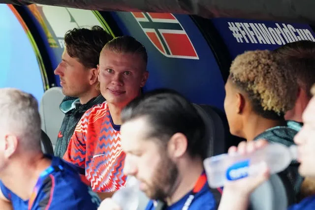 Haaland watches on from the dugout