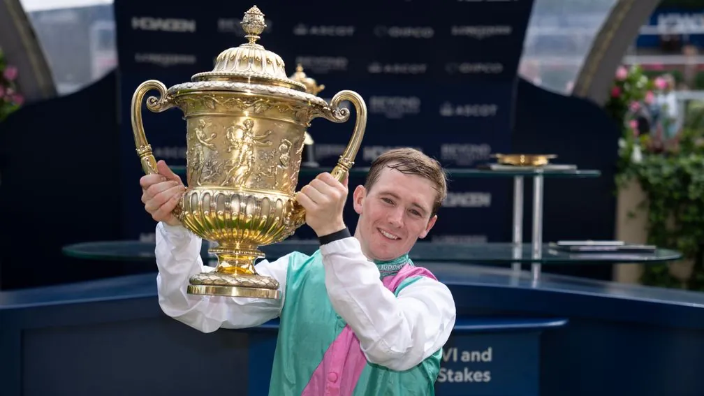Colin Keane celebrates with the King George trophy