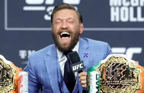 Conor McGregor laughs during a news conference on Thursday ahead of his comeback fight.